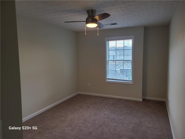 303 Tara Commons Cir, Loganville, GA 30052 - unfurnished room featuring carpet floors, a ceiling fan, and a textured ceiling