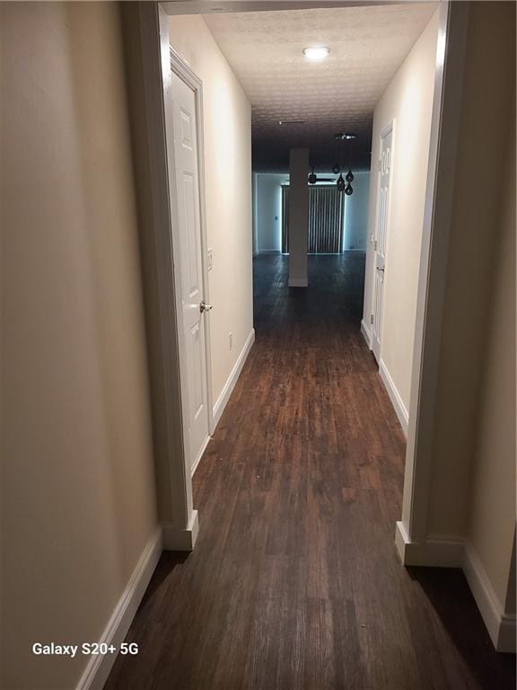 303 Tara Commons Cir, Loganville, GA 30052 - corridor featuring dark wood finished floors and baseboards