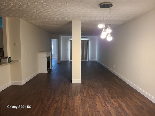 303 Tara Commons Cir, Loganville, GA 30052 - spare room with dark wood-style flooring and a fireplace