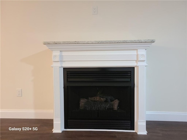 303 Tara Commons Cir, Loganville, GA 30052 - detailed view of a fireplace and wood finished floors