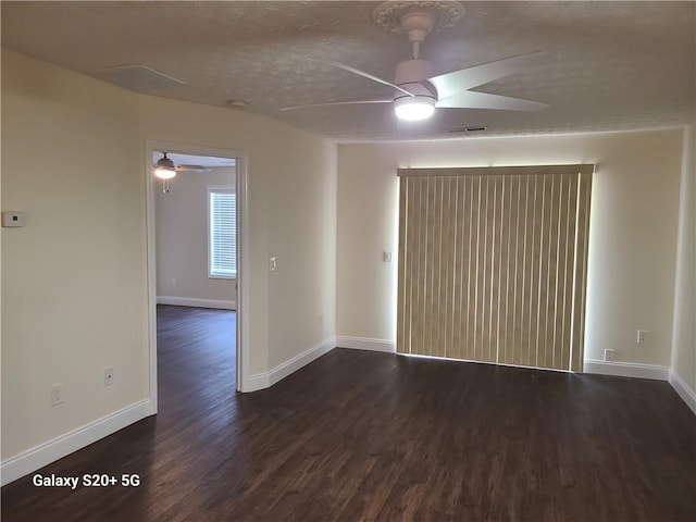 303 Tara Commons Cir, Loganville, GA 30052 - unfurnished room featuring ceiling fan, dark wood-style flooring, and a textured ceiling