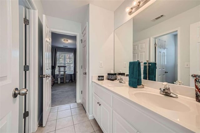 bathroom with vanity and tile patterned flooring