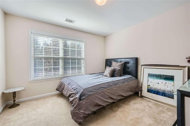 bedroom with light colored carpet