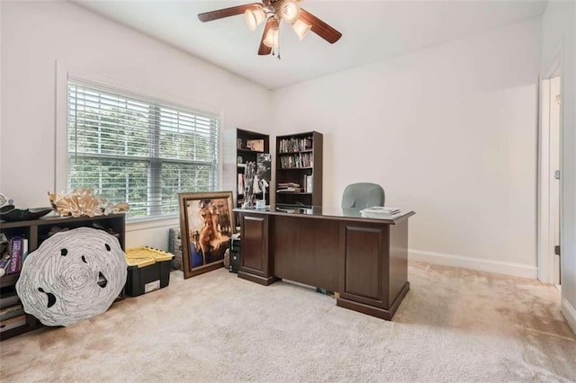 carpeted home office with ceiling fan