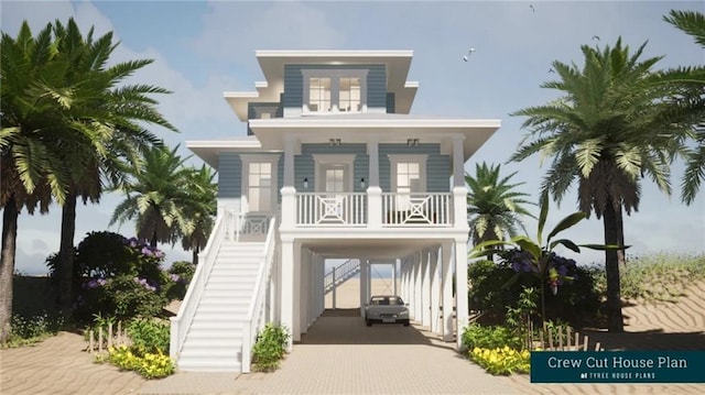 beach home featuring a porch, decorative driveway, a carport, and stairs