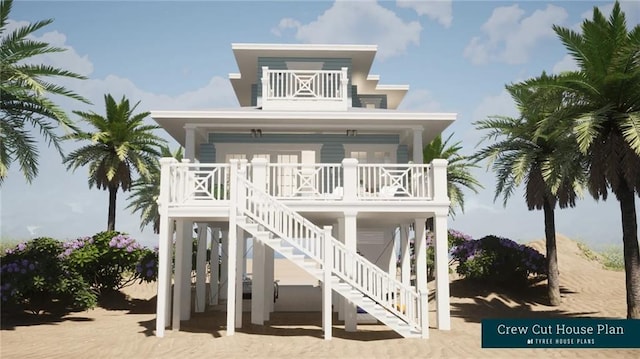 view of front facade with a balcony, covered porch, and stairway