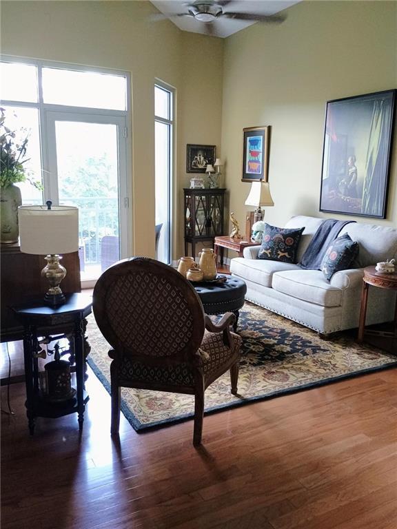 711 Cosmopolitan Dr NE Unit 123, Atlanta, GA 30324 - living room featuring plenty of natural light, ceiling fan, and wood finished floors