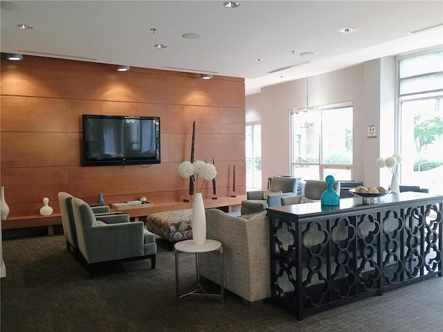 711 Cosmopolitan Dr NE Unit 123, Atlanta, GA 30324 - living area featuring carpet floors and plenty of natural light