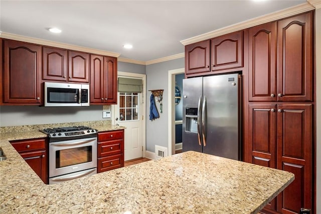 kitchen featuring light stone counters, crown molding, and appliances with stainless steel finishes