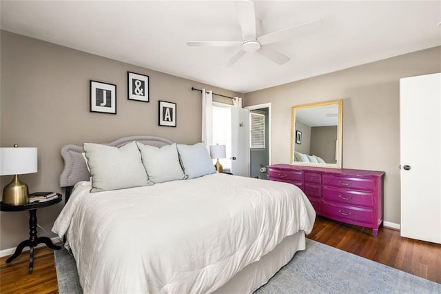 bedroom with ceiling fan and dark hardwood / wood-style flooring