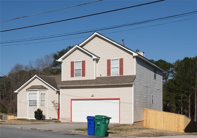 5546 Wellborn Creek Dr, Lithonia, GA 30058 - traditional home with driveway, a garage, and a shingled roof