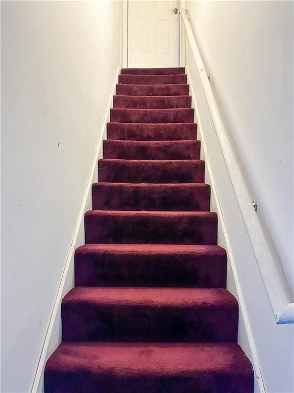 5546 Wellborn Creek Dr, Lithonia, GA 30058 - stairway featuring carpet flooring