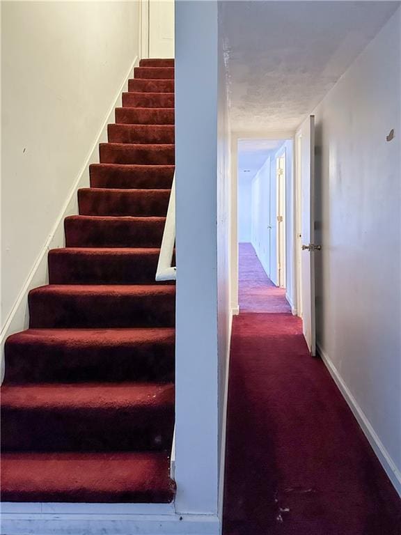 5546 Wellborn Creek Dr, Lithonia, GA 30058 - stairway with baseboards and carpet