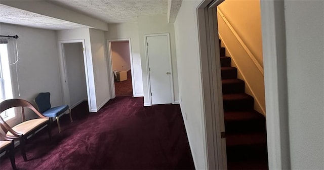 5546 Wellborn Creek Dr, Lithonia, GA 30058 - sitting room featuring dark colored carpet, a textured ceiling, stairway, and baseboards