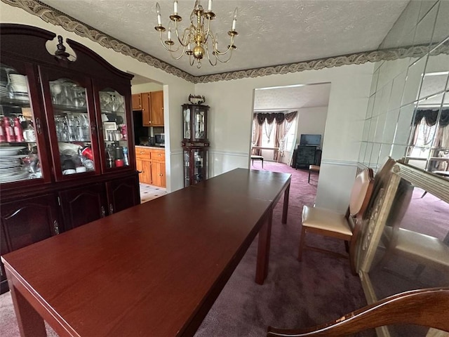 5546 Wellborn Creek Dr, Lithonia, GA 30058 - carpeted dining space featuring a chandelier and a textured ceiling