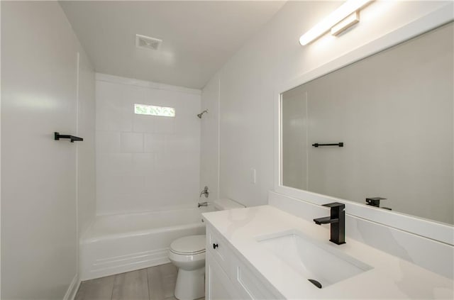 bathroom with visible vents, shower / bath combination, toilet, and vanity
