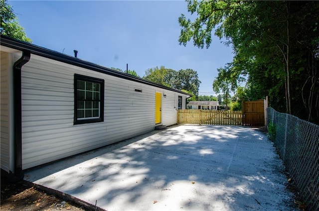 exterior space with a patio and fence