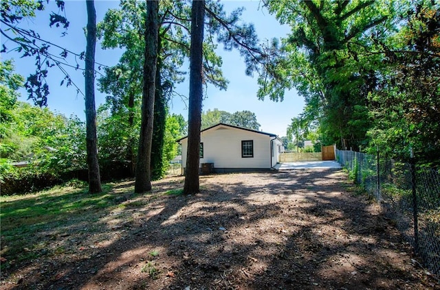 view of home's exterior featuring fence