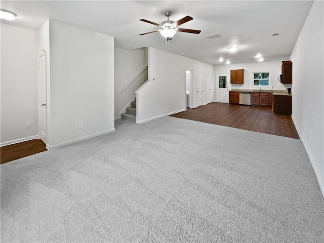4001 Avalon Rd SW, Atlanta, GA 30331 - unfurnished living room featuring baseboards, stairs, ceiling fan, and dark carpet