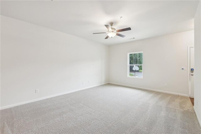 4001 Avalon Rd SW, Atlanta, GA 30331 - empty room featuring ceiling fan, light colored carpet, and baseboards