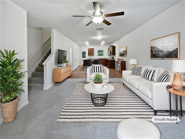 4001 Avalon Rd SW, Atlanta, GA 30331 - living area with a ceiling fan, visible vents, baseboards, light carpet, and stairs