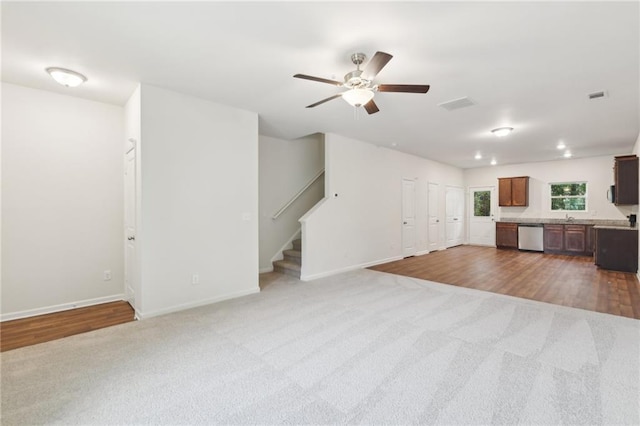 4001 Avalon Rd SW, Atlanta, GA 30331 - unfurnished living room featuring visible vents, carpet flooring, and stairs