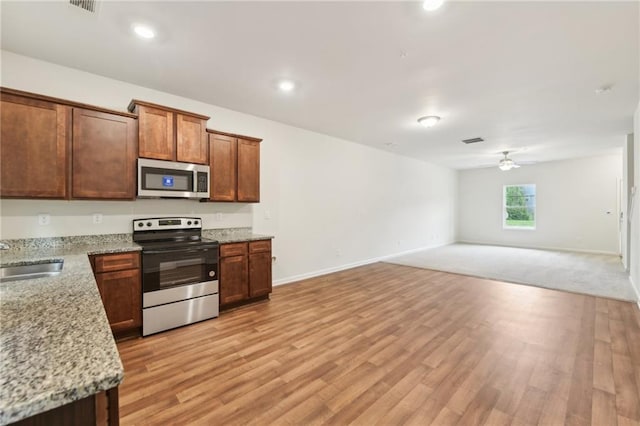 4001 Avalon Rd SW, Atlanta, GA 30331 - kitchen featuring a ceiling fan, light wood-type flooring, a sink, open floor plan, and stainless steel appliances