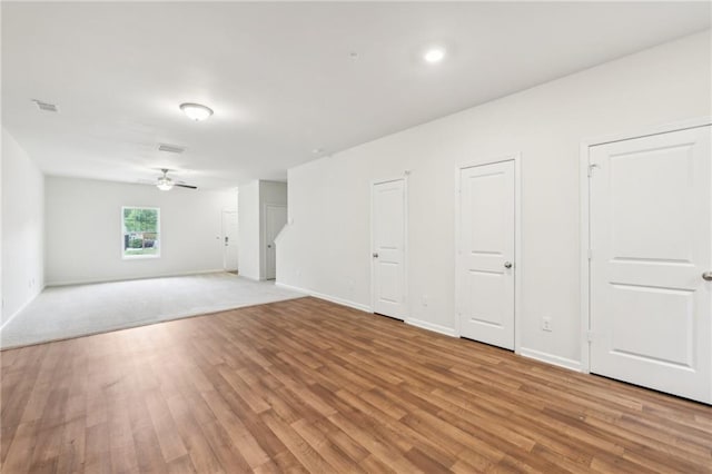 4001 Avalon Rd SW, Atlanta, GA 30331 - unfurnished living room featuring baseboards, a ceiling fan, light wood-style flooring, and visible vents