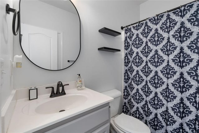 bathroom with vanity, a shower with curtain, and toilet