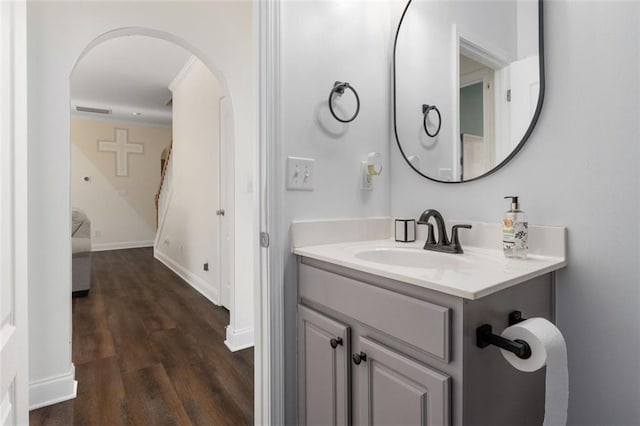 bathroom with hardwood / wood-style flooring and vanity