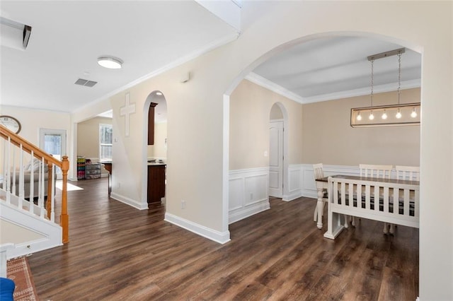 corridor featuring crown molding and dark wood-type flooring