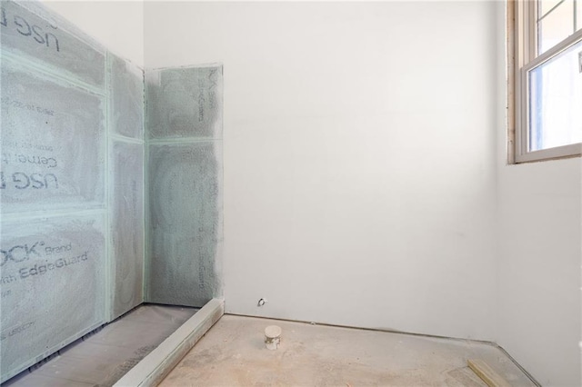 bathroom with concrete flooring