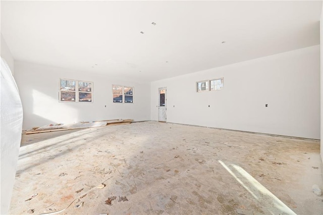 unfurnished living room featuring plenty of natural light