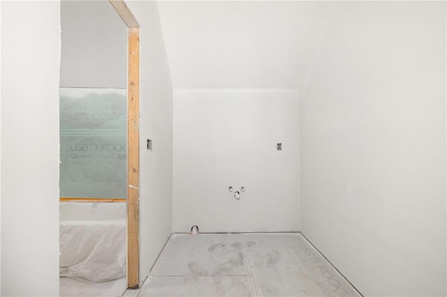 bathroom featuring vaulted ceiling