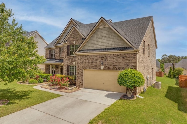 3039 Tuscan Ridge Dr, Snellville, GA 30039 - craftsman house featuring driveway, a front yard, a garage, and brick siding