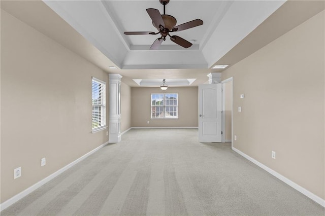 3039 Tuscan Ridge Dr, Snellville, GA 30039 - empty room featuring a tray ceiling, baseboards, and light colored carpet