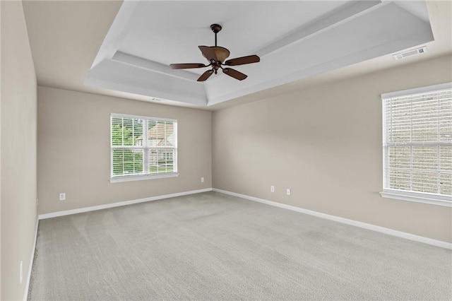 3039 Tuscan Ridge Dr, Snellville, GA 30039 - spare room with a tray ceiling, baseboards, carpet flooring, and a ceiling fan