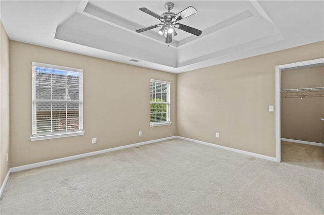 3039 Tuscan Ridge Dr, Snellville, GA 30039 - unfurnished bedroom with a raised ceiling, carpet floors, baseboards, a walk in closet, and a closet