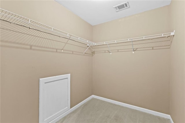 3039 Tuscan Ridge Dr, Snellville, GA 30039 - walk in closet featuring carpet flooring