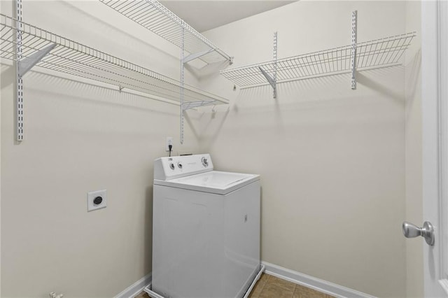 3039 Tuscan Ridge Dr, Snellville, GA 30039 - laundry area with washer / clothes dryer, baseboards, and tile patterned flooring
