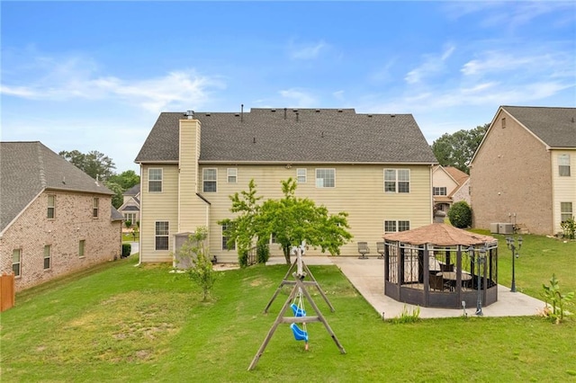 3039 Tuscan Ridge Dr, Snellville, GA 30039 - rear view of house with a gazebo, a patio, a chimney, and a yard