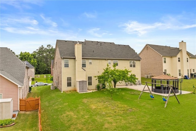 3039 Tuscan Ridge Dr, Snellville, GA 30039 - back of house featuring a chimney, a gazebo, and central AC