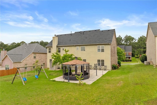 3039 Tuscan Ridge Dr, Snellville, GA 30039 - back of house with a gazebo, a patio, a playground, central AC unit, and a chimney