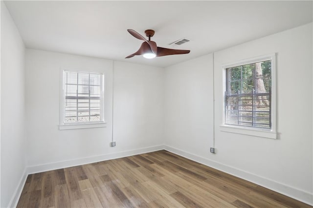 unfurnished room featuring hardwood / wood-style flooring and ceiling fan