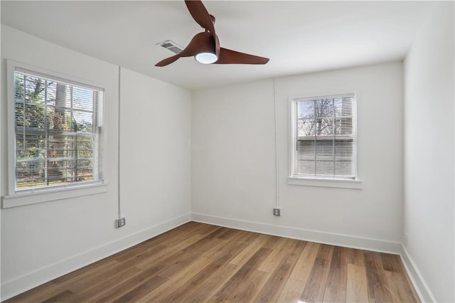 unfurnished room featuring hardwood / wood-style floors and ceiling fan