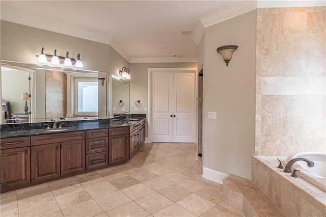 full bathroom featuring ornamental molding, double vanity, and tiled bath