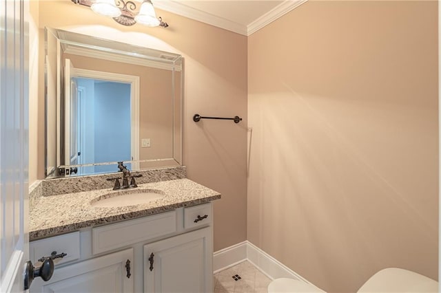half bathroom with toilet, crown molding, vanity, baseboards, and tile patterned floors