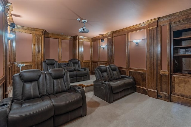 carpeted cinema featuring a decorative wall