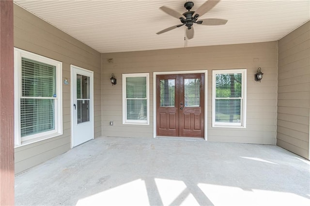 doorway to property featuring a ceiling fan, a patio, and french doors