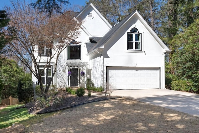 view of front of property with driveway and stucco siding